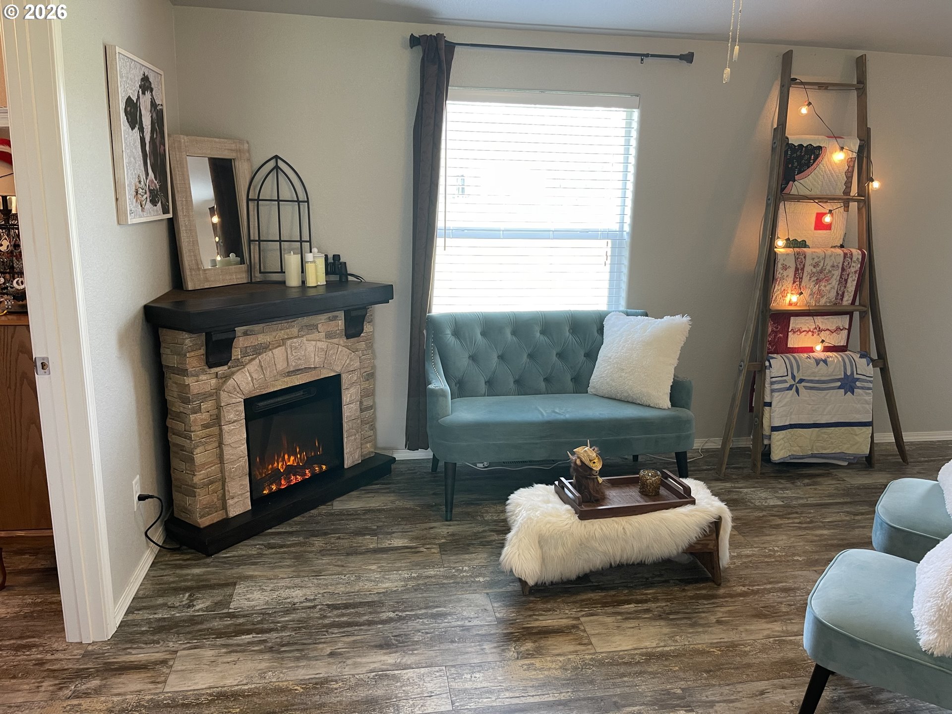 6404 Lookingglass Road Roseburg, OR 97471 - Photo 22 of 48 a living room with furniture and a fireplace