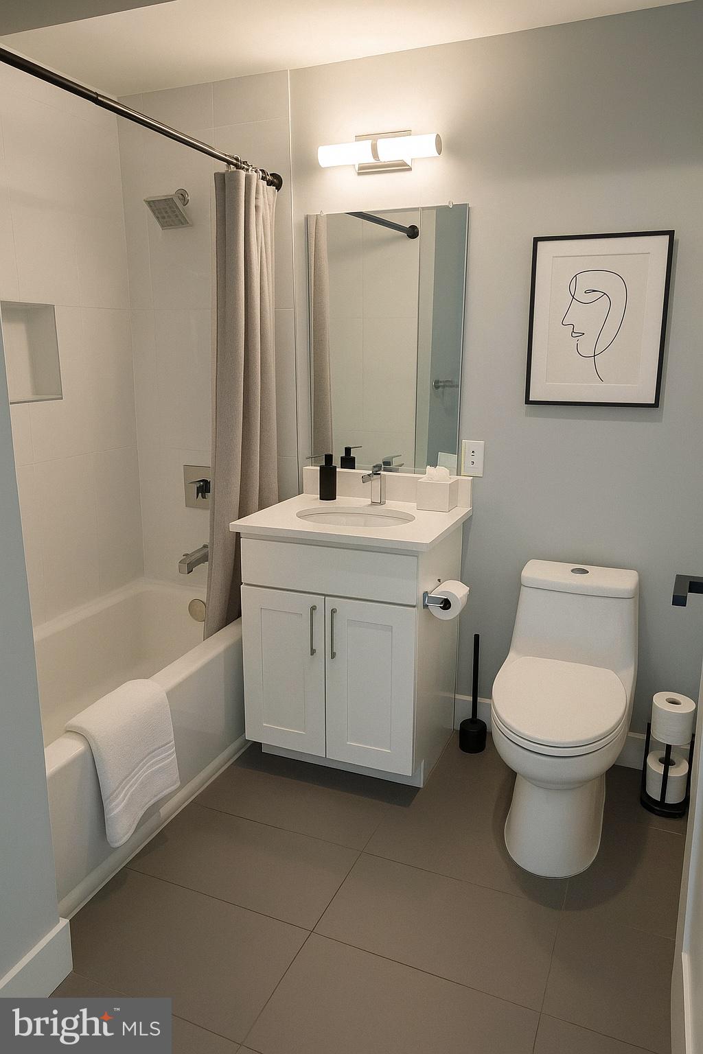 1101 Fern Street Northwest, Unit 301 Washington, DC 20012 - Photo 19 of 25 a bathroom with a sink toilet and shower