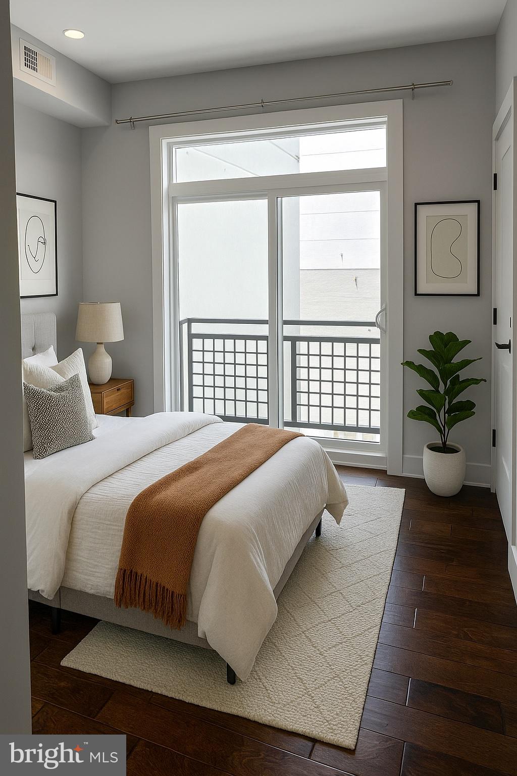 1101 Fern Street Northwest, Unit 301 Washington, DC 20012 - Photo 20 of 25 a bedroom with a large bed and a large window