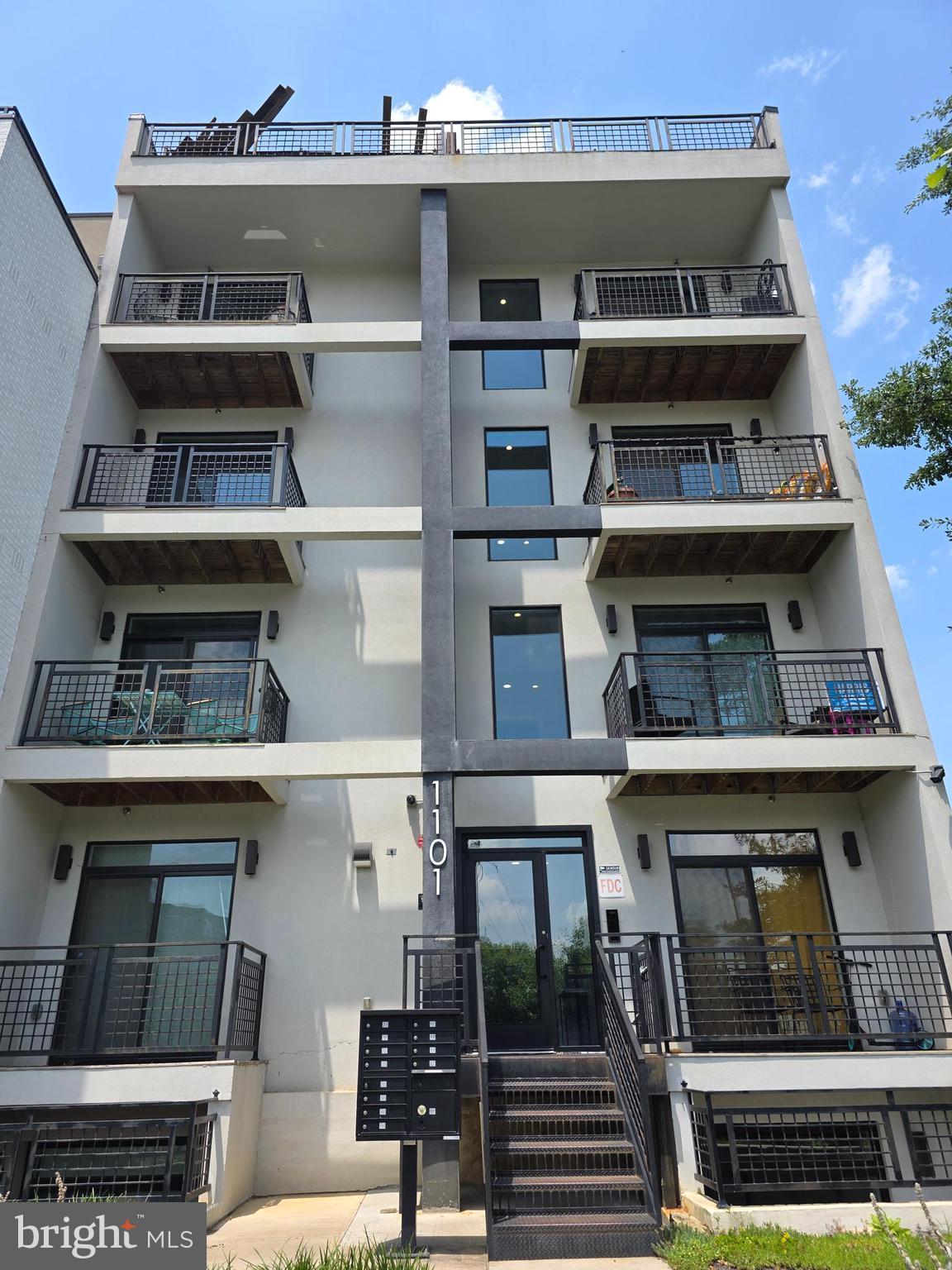 1101 Fern Street Northwest, Unit 301 Washington, DC 20012 - Photo 2 of 25 a view of a building with shelves