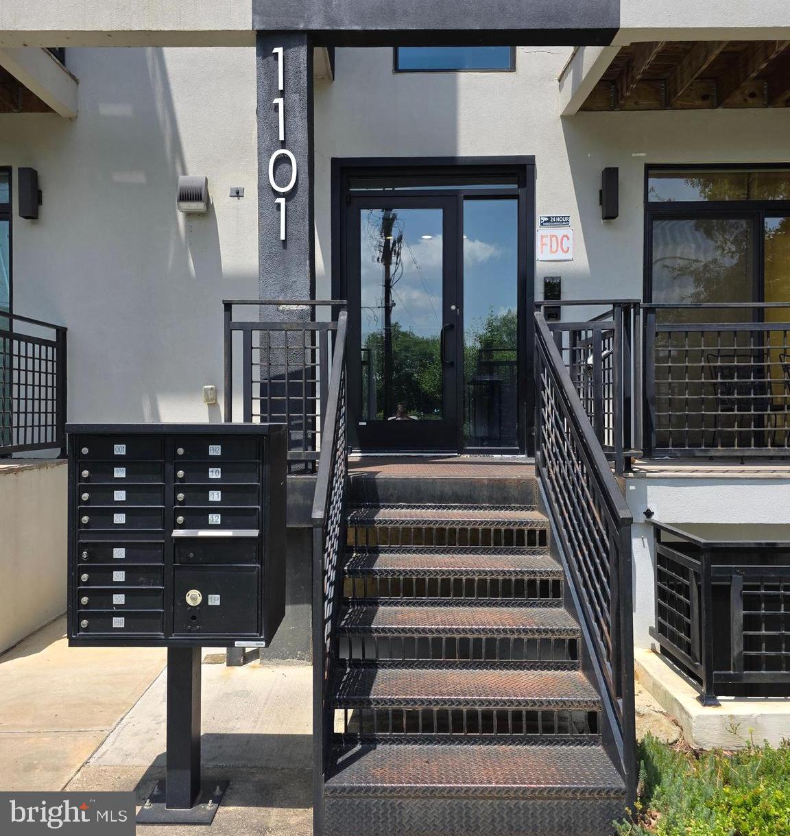 1101 Fern Street Northwest, Unit 301 Washington, DC 20012 - Photo 3 of 25 a view of entryway and hall with wooden floor