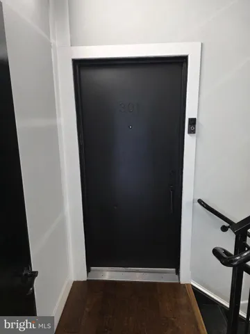 a view of kitchen with kitchen island dining table and chairs