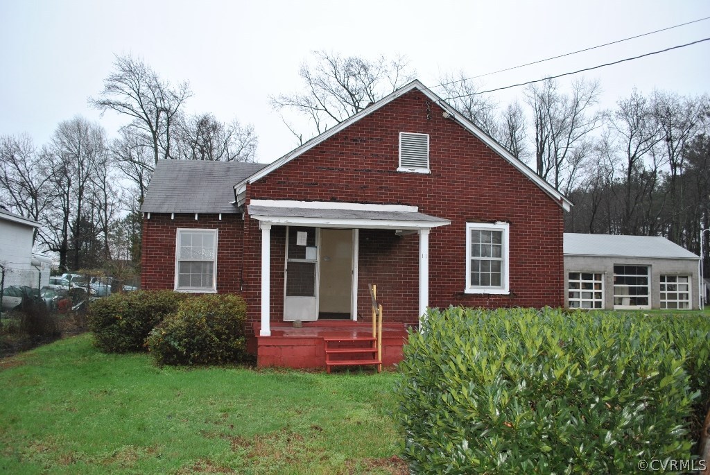 11 Rodman Road Richmond, VA 23224 - Photo 13 of 15 a front view of a house with a yard and porch