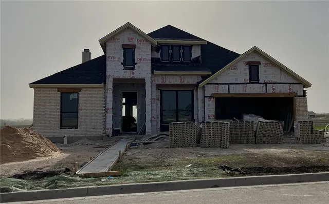 a front view of a house with garage