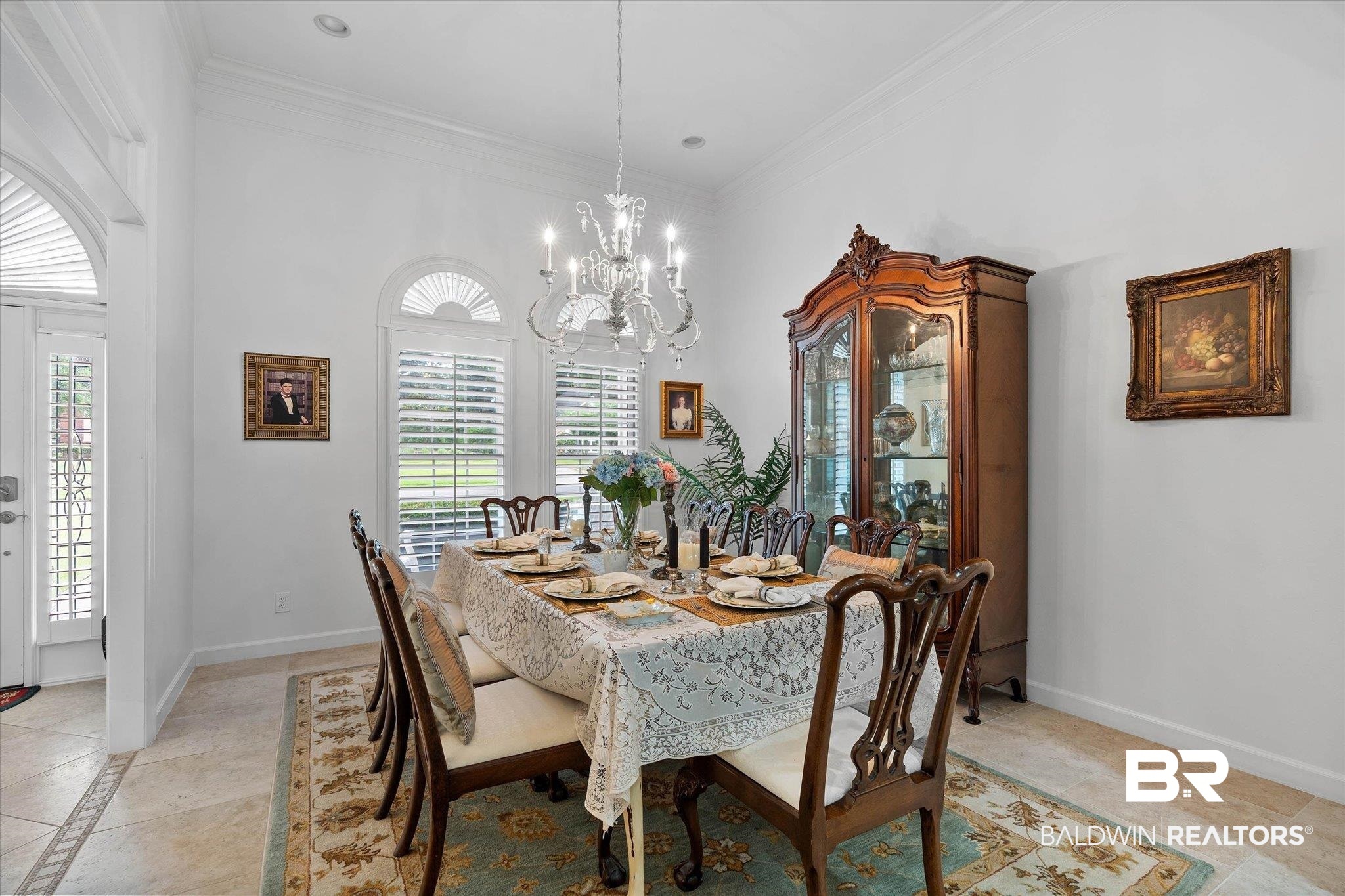 136 Old Mill Road Fairhope, AL 36532 - Photo 3 of 36 Formal dining area featuring a crystal chandelier and tile flooring