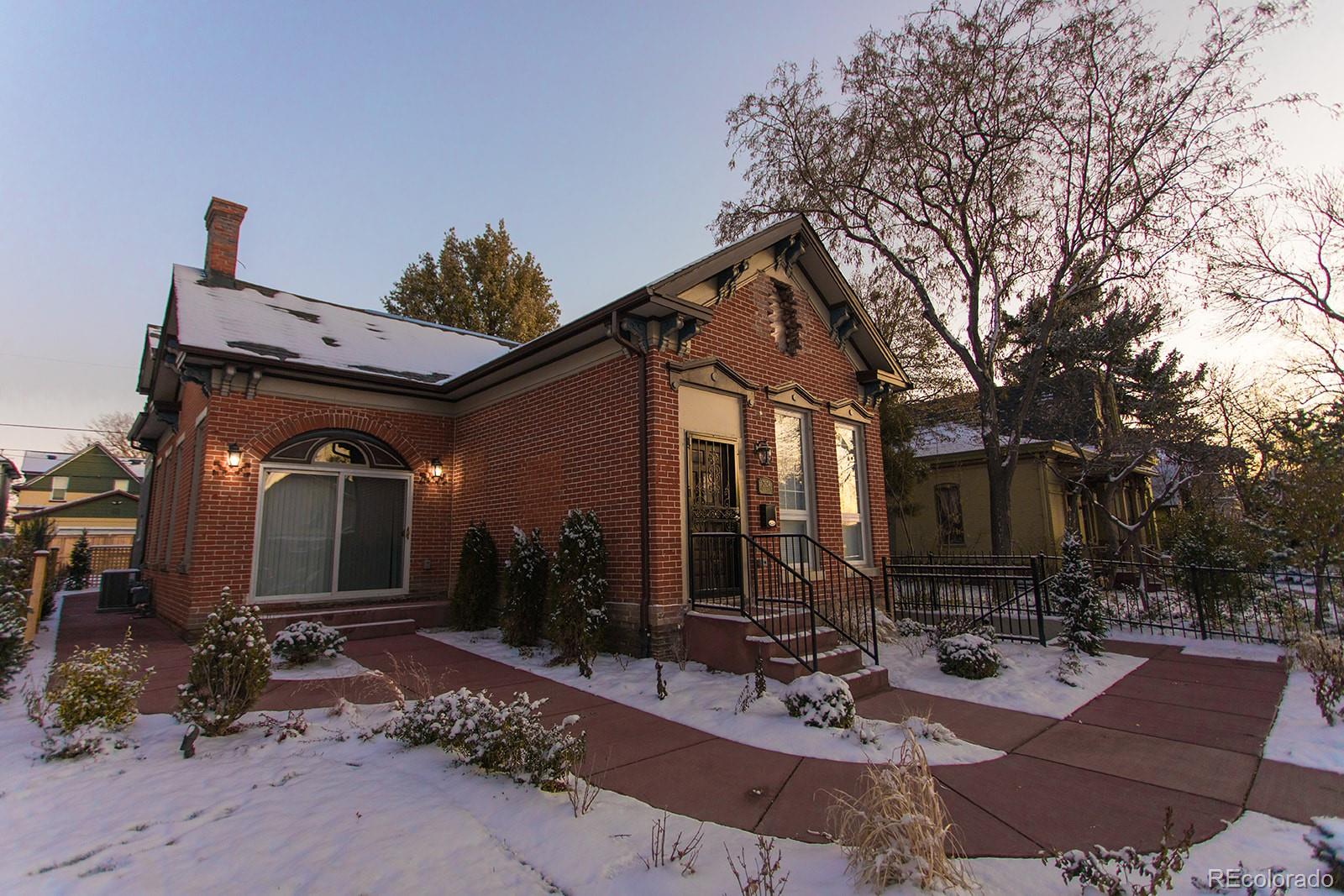 2834 Curtis Street, Unit 3 Denver, CO 80205 - Photo 1 of 22 a view of a house with yard and sitting area
