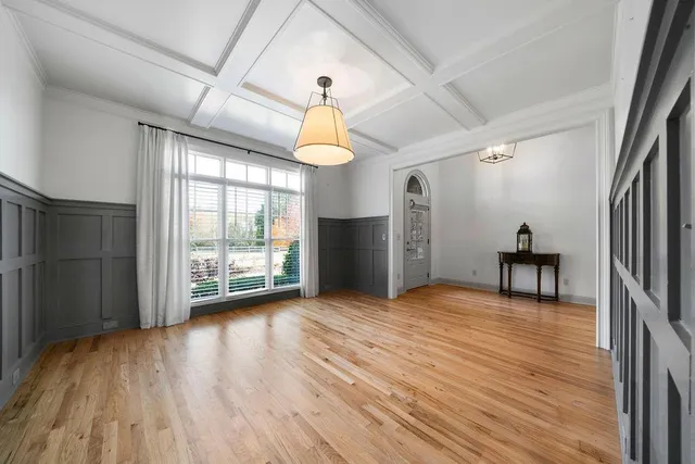 a view of entryway livingroom and hall with wooden floor