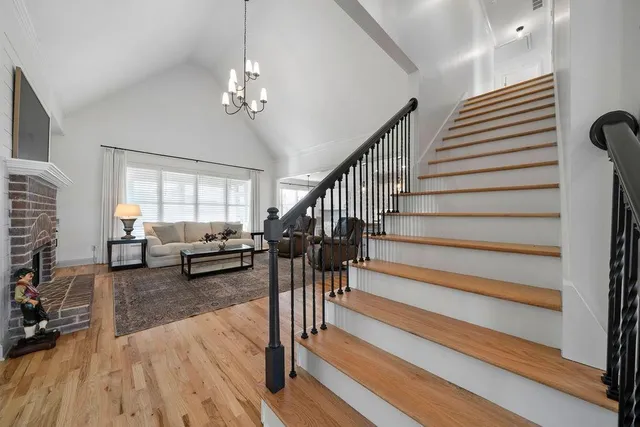 a living room with furniture fireplace and a flat screen tv