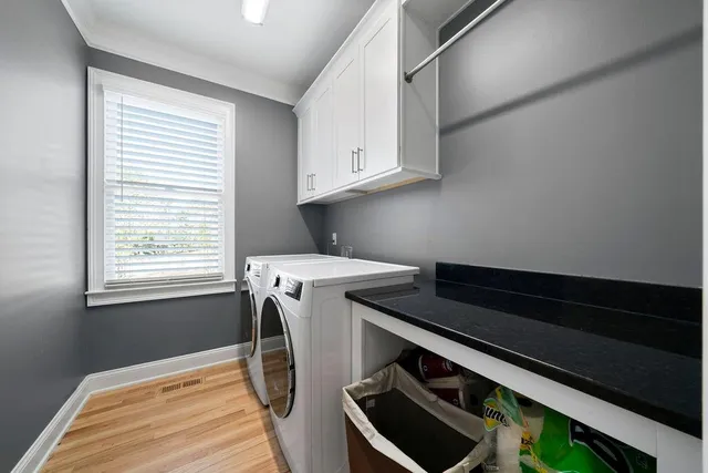 a kitchen with stainless steel appliances granite countertop a sink and cabinets