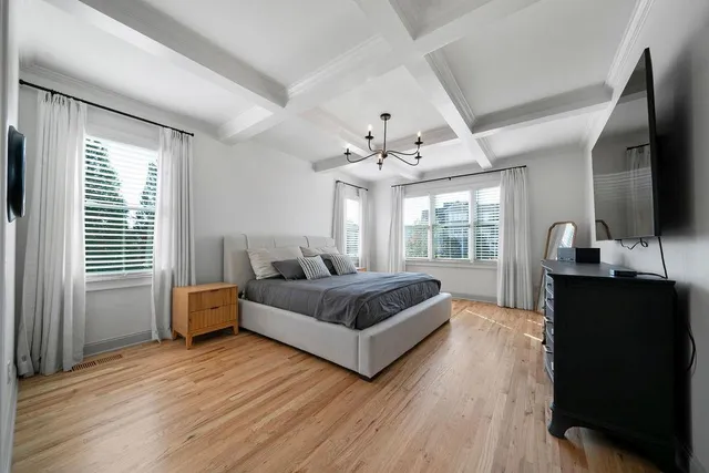 a spacious bathroom with a tub sink and mirror
