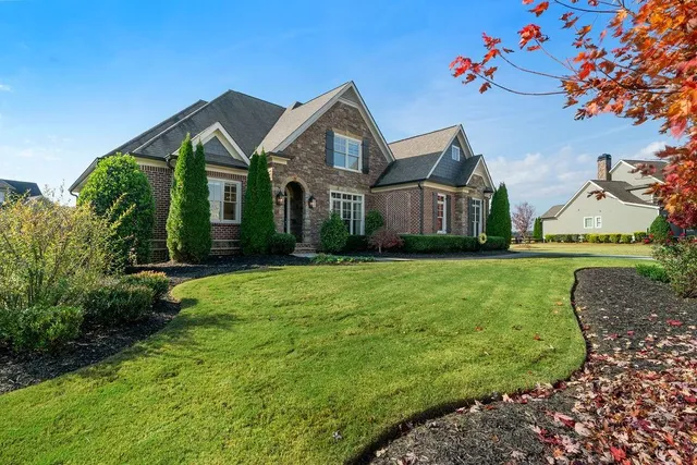 a front view of a house with a yard