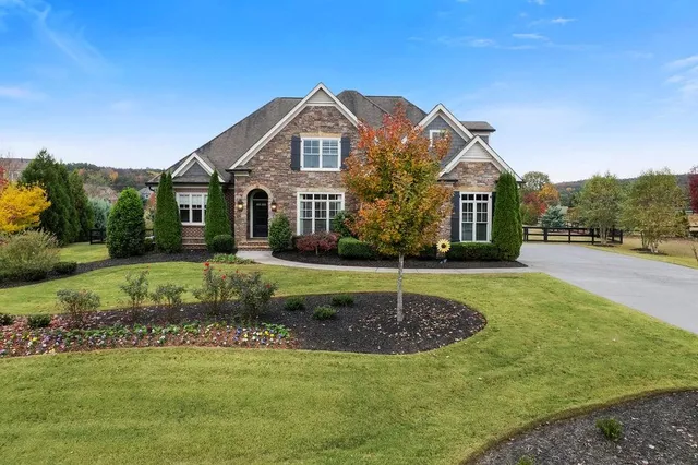 a front view of a house with a yard