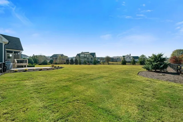 a utility room with dryer and baby crib