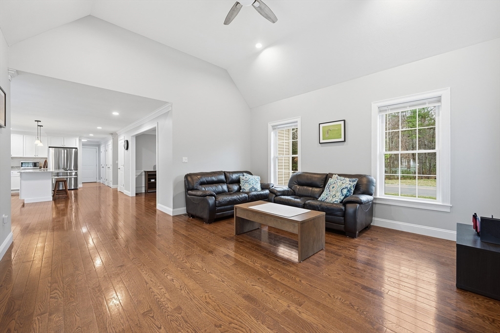 44 Bacon Street Pepperell, MA 01463 - Photo 15 of 42 a living room with furniture and a wooden floor