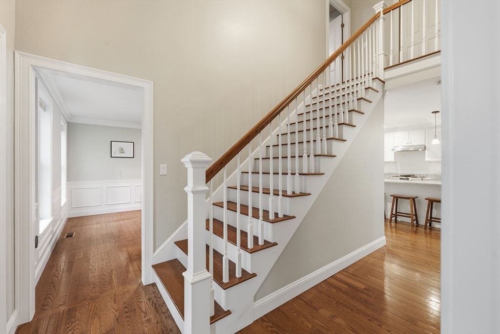 44 Bacon Street Pepperell, MA 01463 - Photo 18 of 42 a view of staircase with wooden floor and white walls