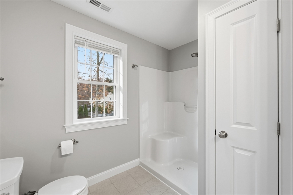 44 Bacon Street Pepperell, MA 01463 - Photo 23 of 42 a bathroom with a shower toilet and sink