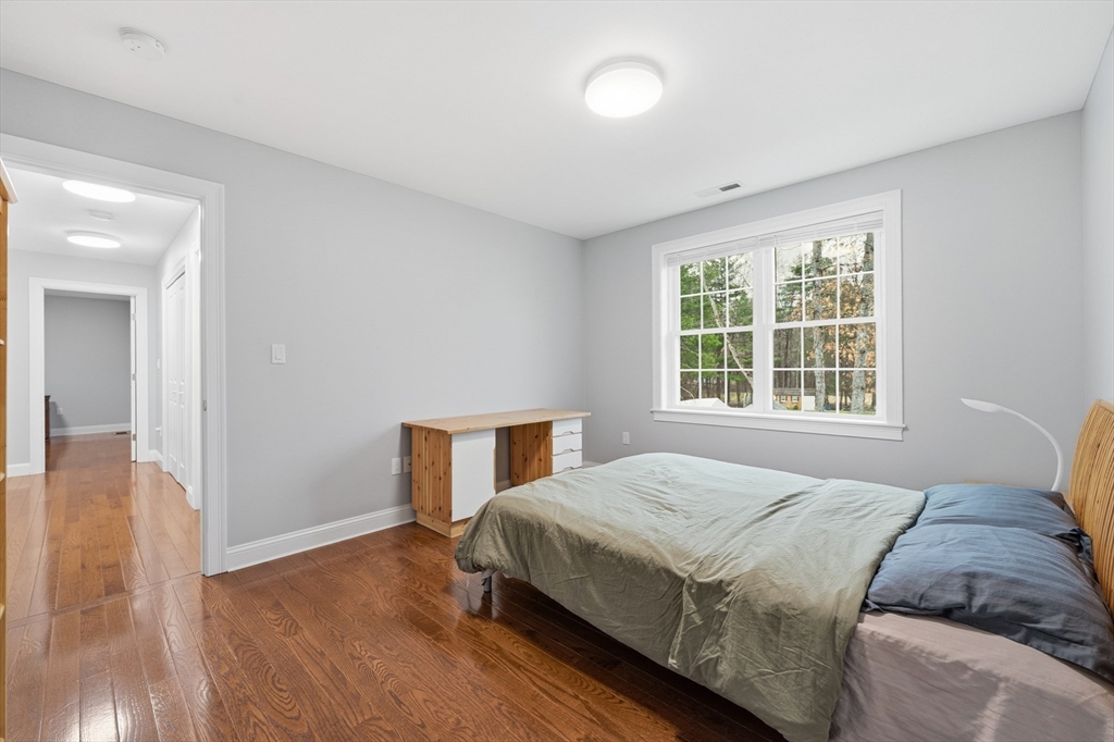 44 Bacon Street Pepperell, MA 01463 - Photo 24 of 42 a bedroom with a bed and a window