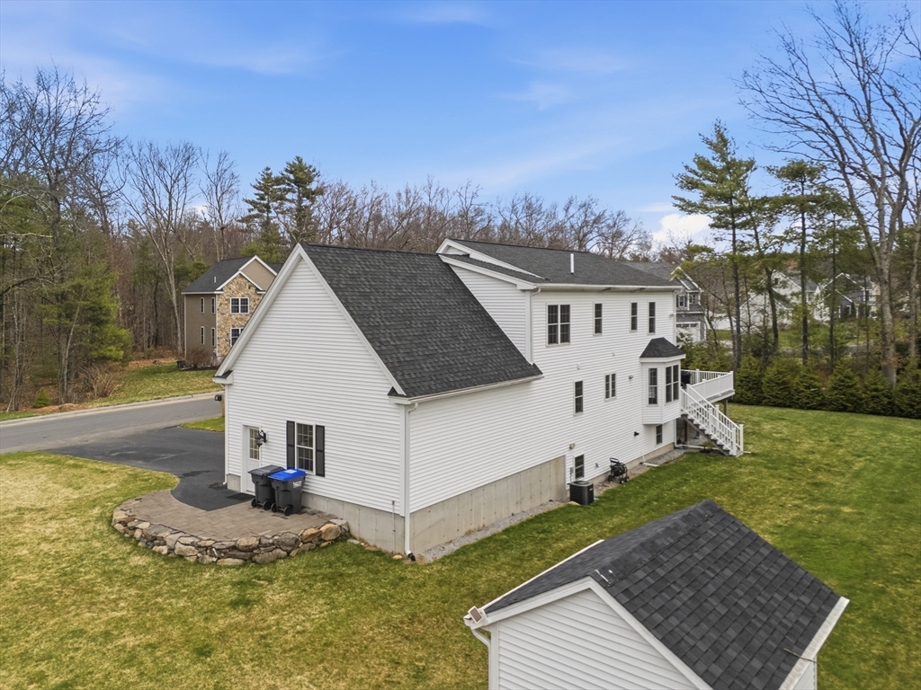 44 Bacon Street Pepperell, MA 01463 - Photo 31 of 42 a view of a house with a yard