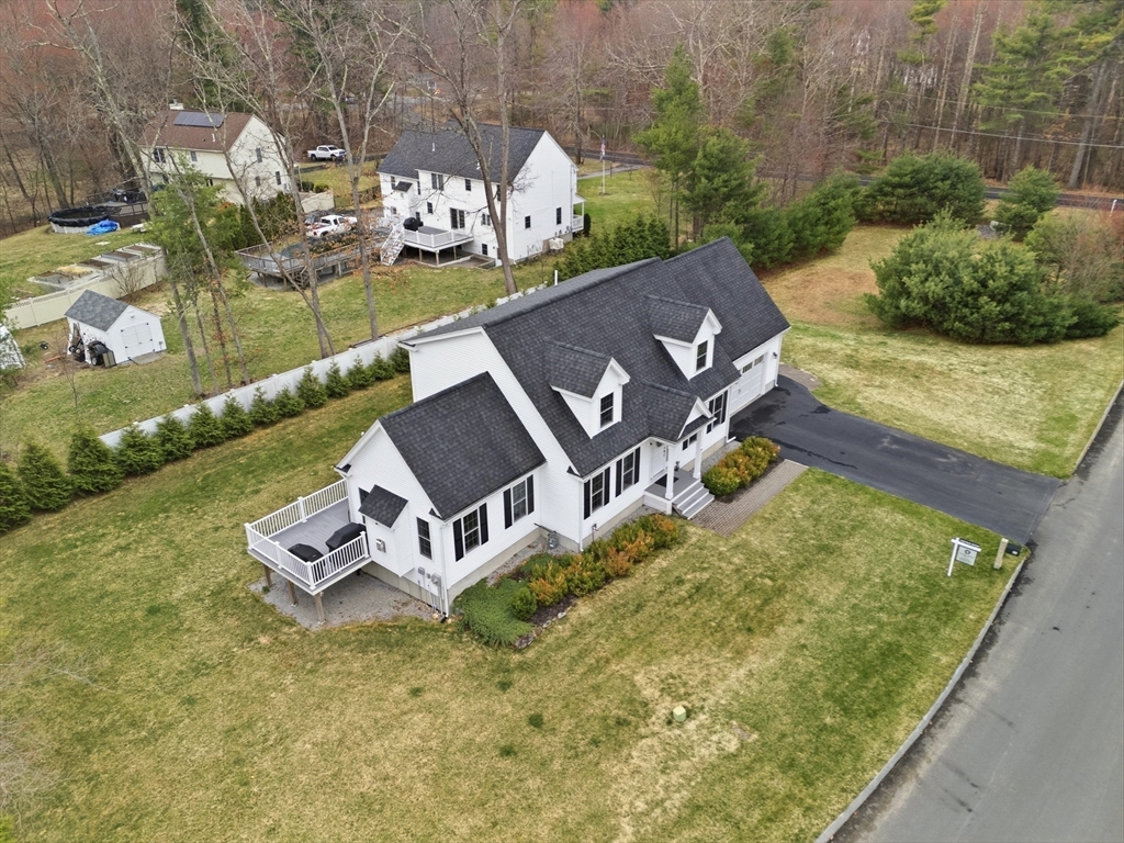 44 Bacon Street Pepperell, MA 01463 - Photo 32 of 42 a view of a house with pool