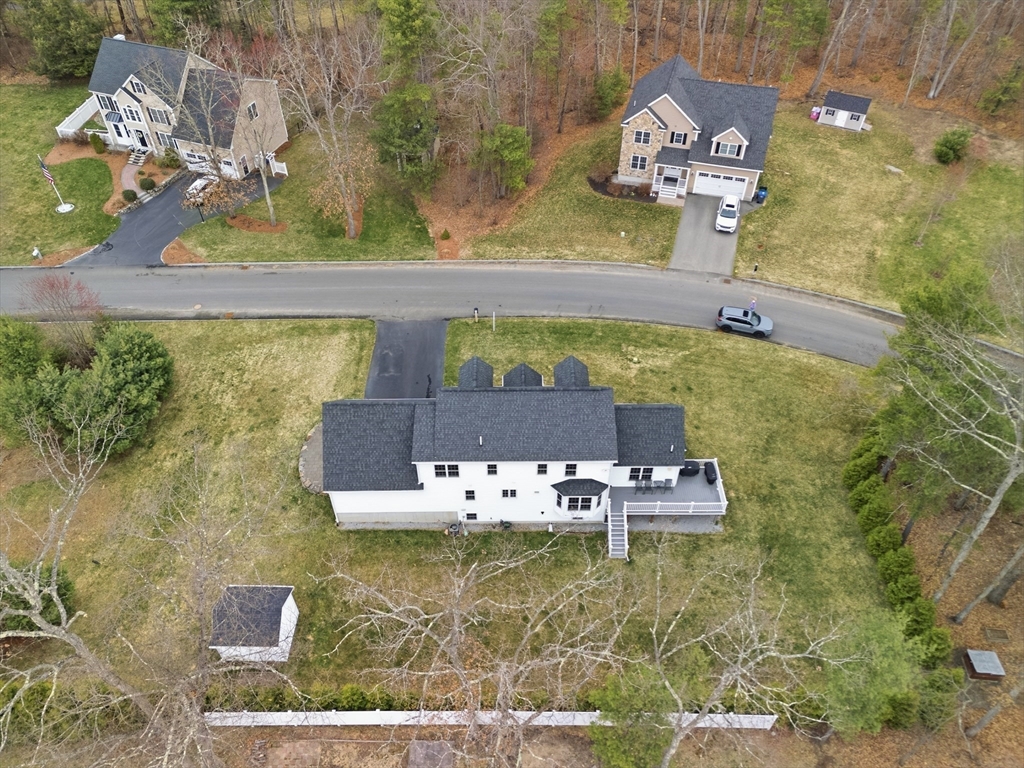 44 Bacon Street Pepperell, MA 01463 - Photo 35 of 42 an aerial view of a house with a swimming pool