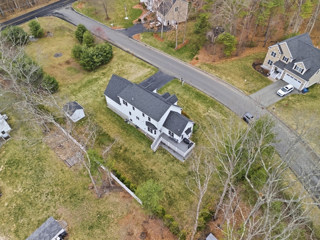 44 Bacon Street Pepperell, MA 01463 - Photo 36 of 42 an aerial view of a house with a yard