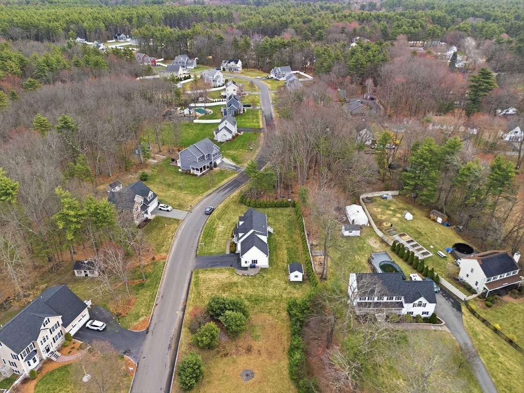 44 Bacon Street Pepperell, MA 01463 - Photo 39 of 42 an aerial view of a house with a swimming pool