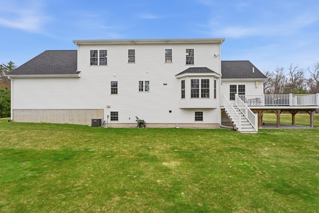 44 Bacon Street Pepperell, MA 01463 - Photo 4 of 42 front view of a house with a yard