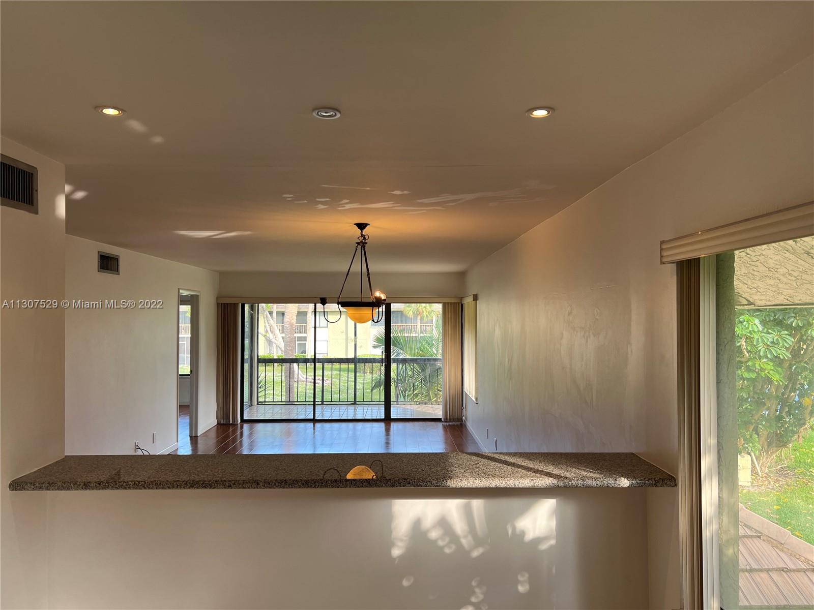159 Northwest 70th Street, Unit 512 Boca Raton, FL 33487 - Photo 5 of 43 a view of empty room with window