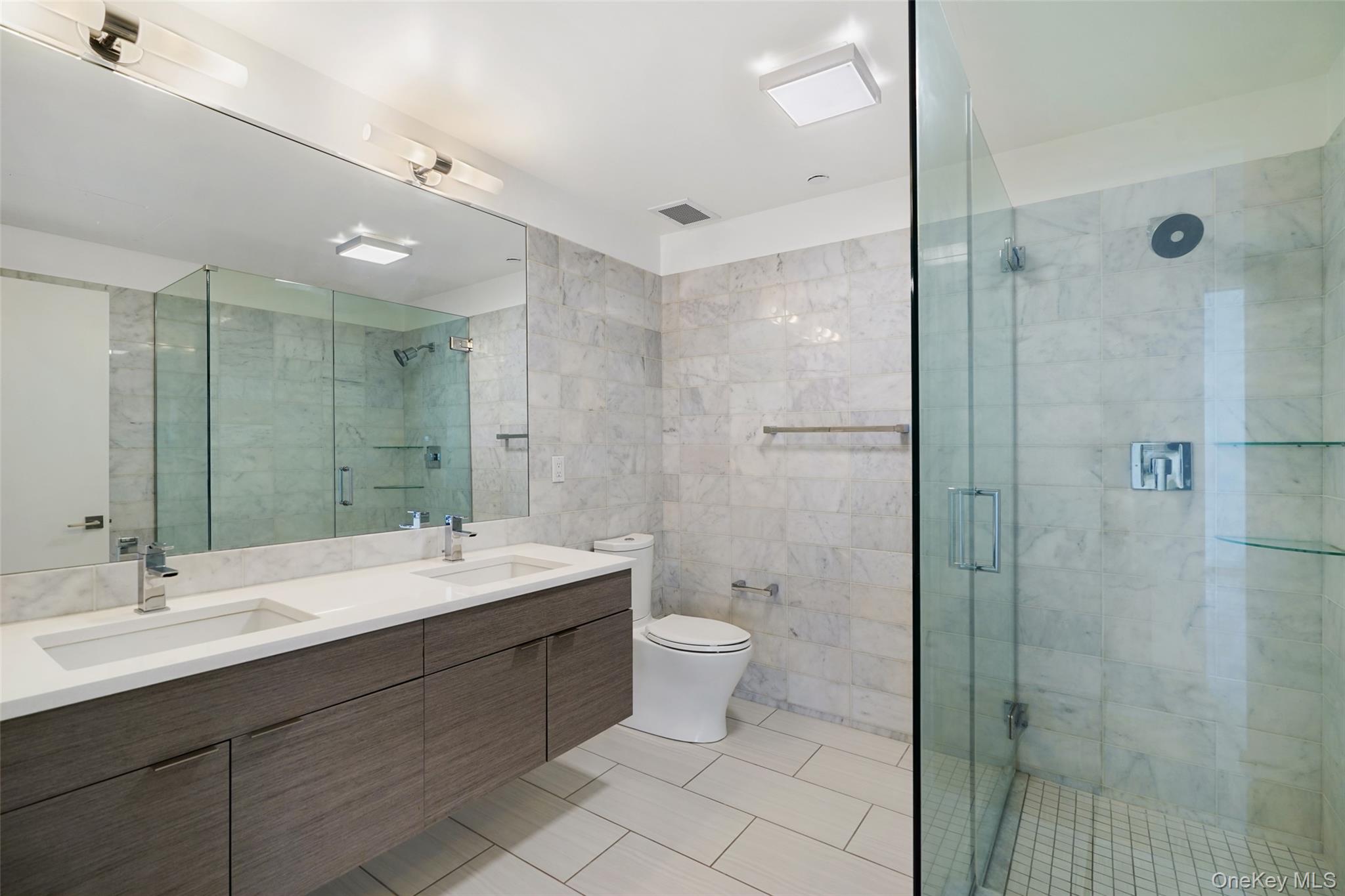 2 2nd Street, Unit 34 Rye, NY 10580 - Photo 5 of 6 Full bath with a shower stall, toilet, and a sink