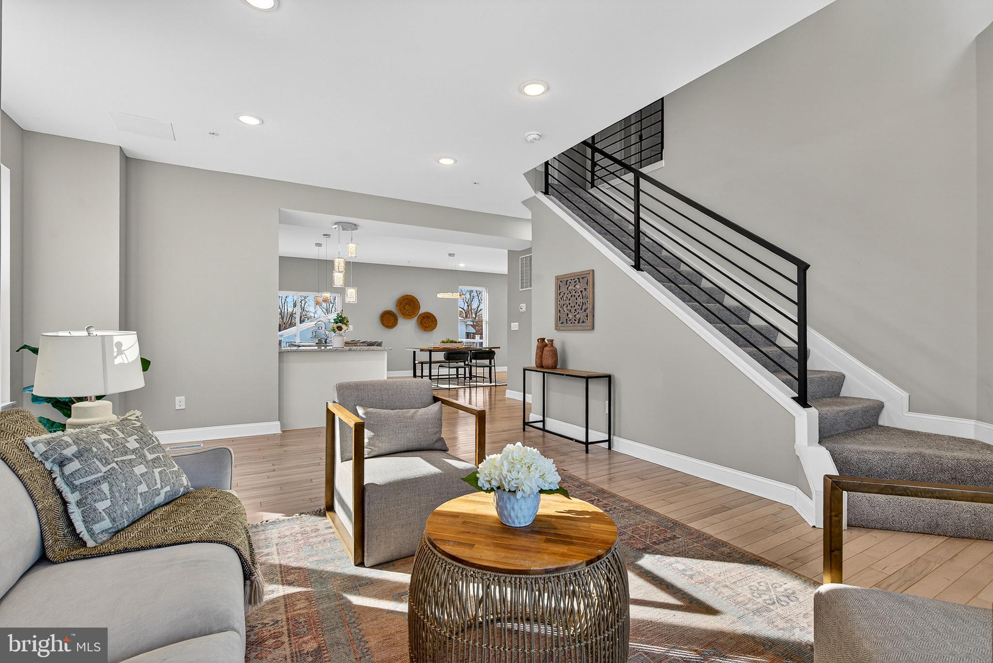 a living room with furniture and a rug