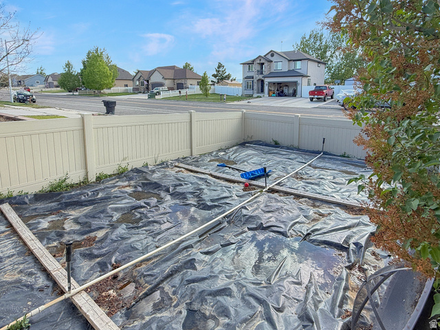 1716 Sagewood Road Price, UT 84501 - Photo 71 of 73 Rear yard area featuring a light-colored privacy fence and a dark ground covering