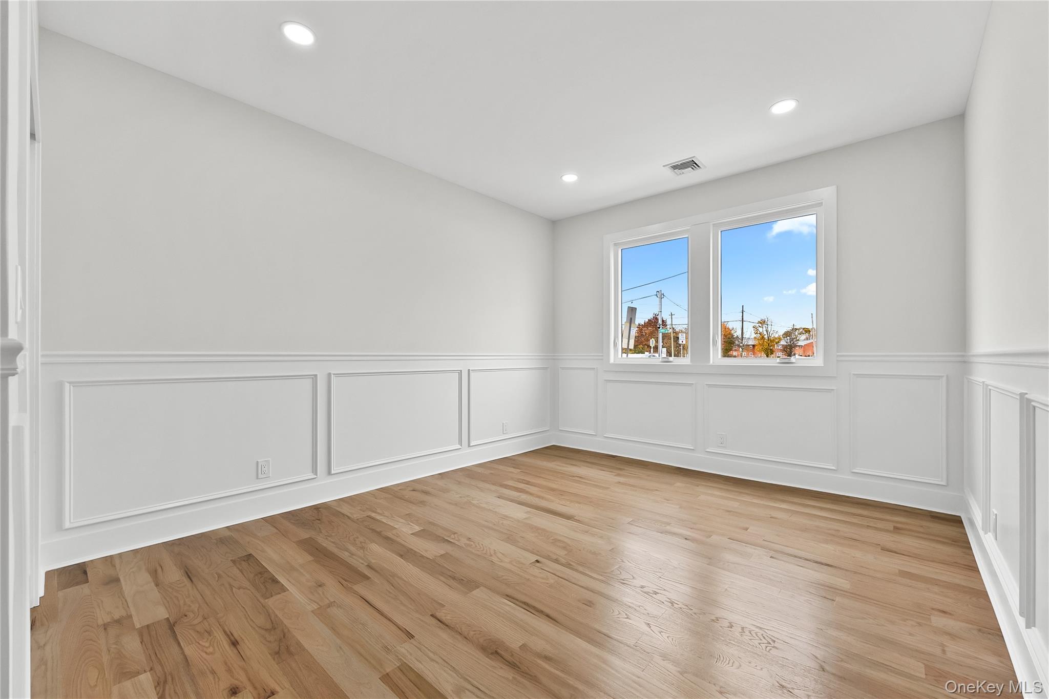 2 Orchid Road Levittown, NY 11756 - Photo 15 of 46 an empty room with wooden floor and window