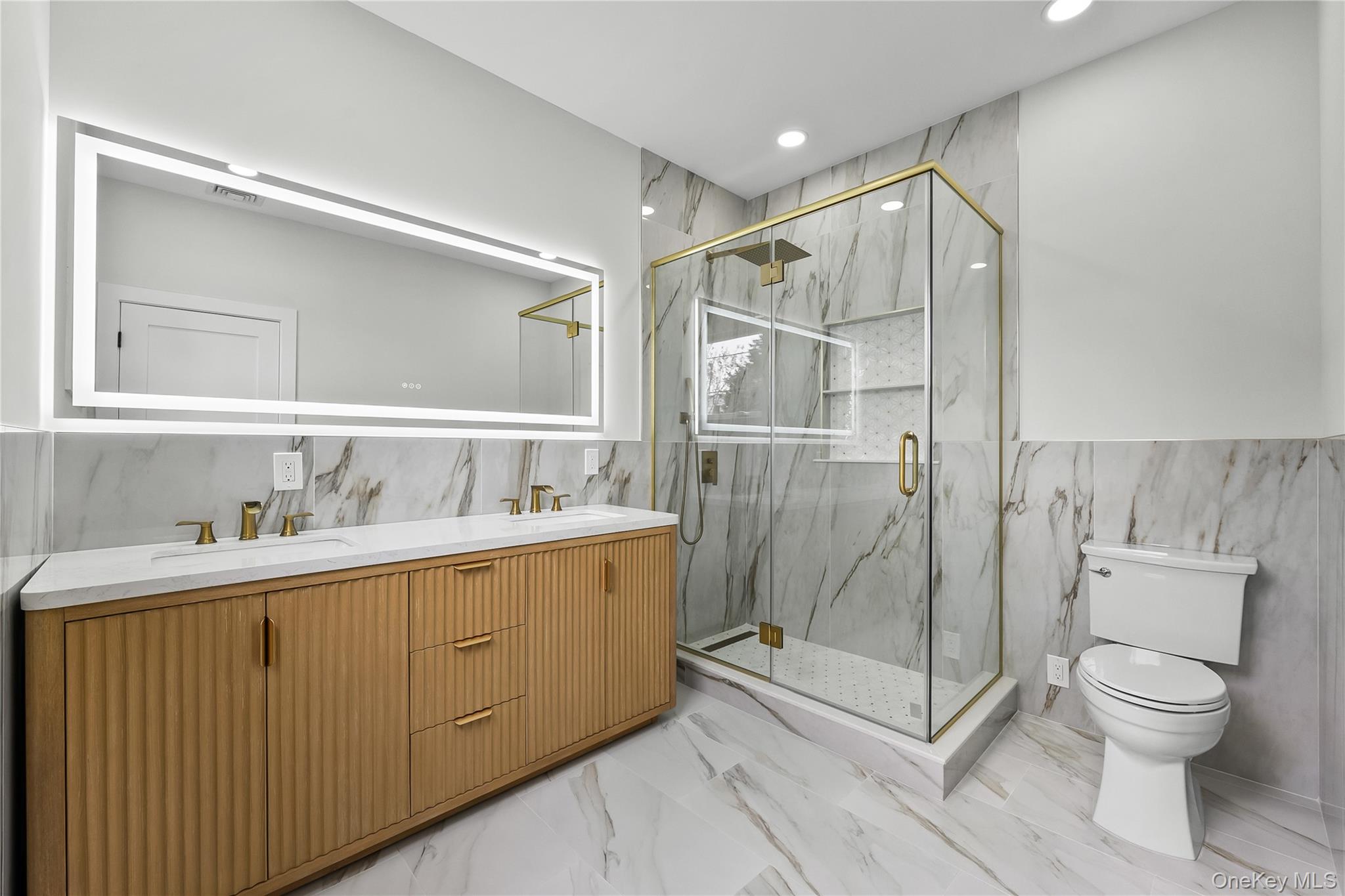 2 Orchid Road Levittown, NY 11756 - Photo 19 of 46 a bathroom with a toilet a sink and shower