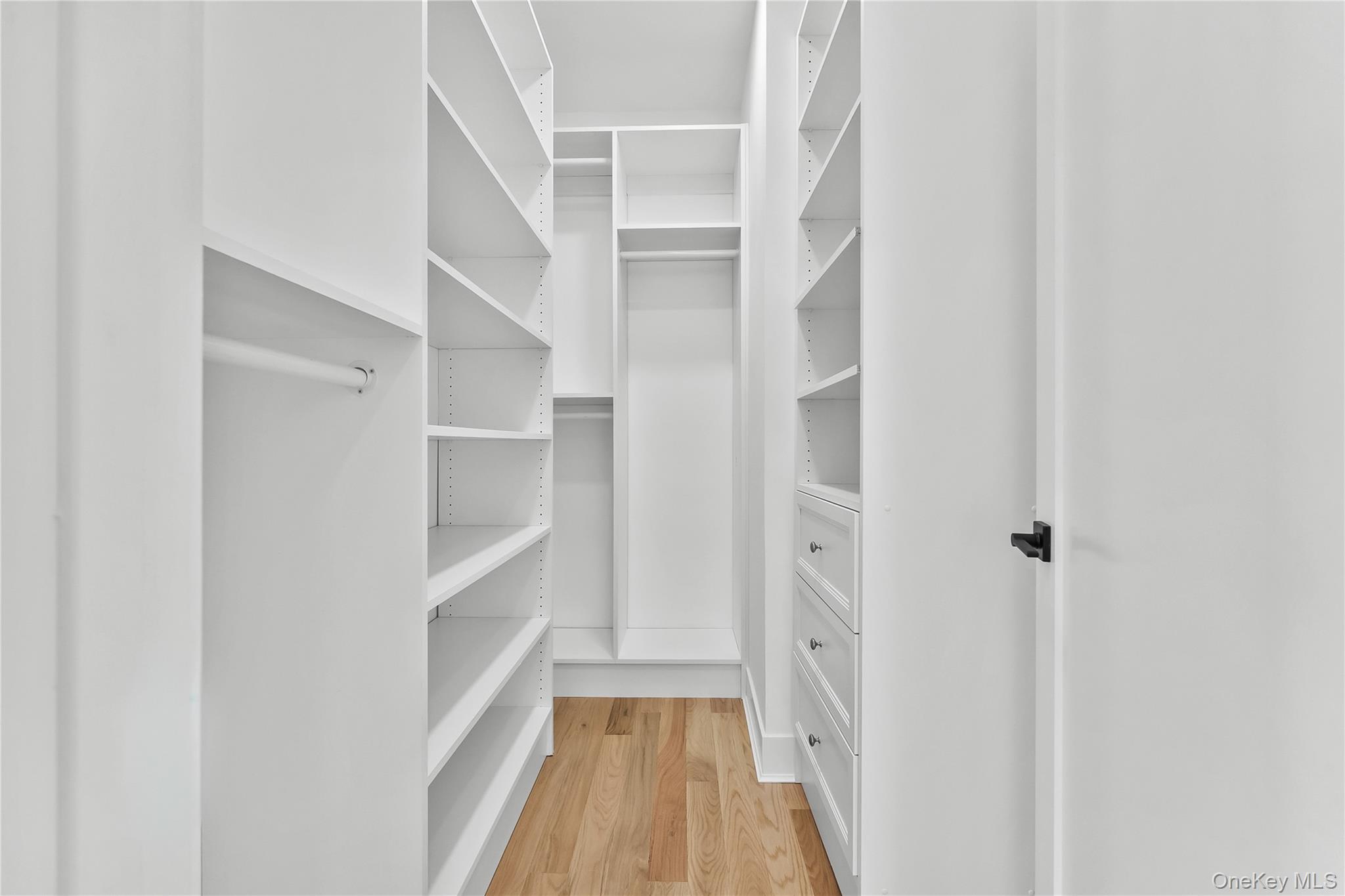 2 Orchid Road Levittown, NY 11756 - Photo 20 of 46 a view of walk in closet with empty racks