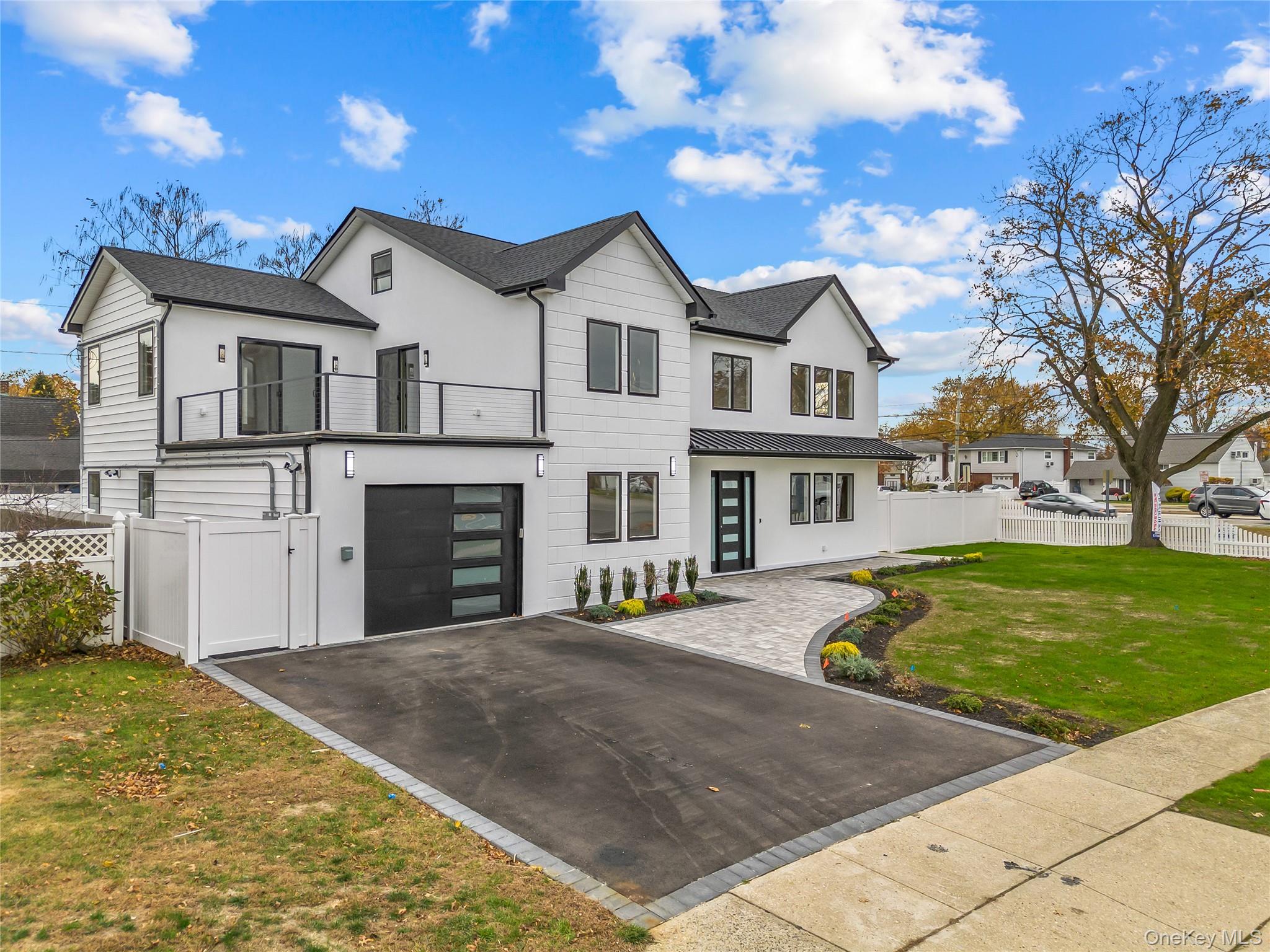2 Orchid Road Levittown, NY 11756 - Photo 2 of 46 a front view of a house with a yard