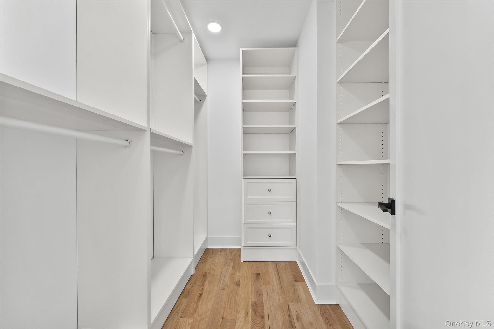 2 Orchid Road Levittown, NY 11756 - Photo 27 of 46 a view of walk in closet with empty racks