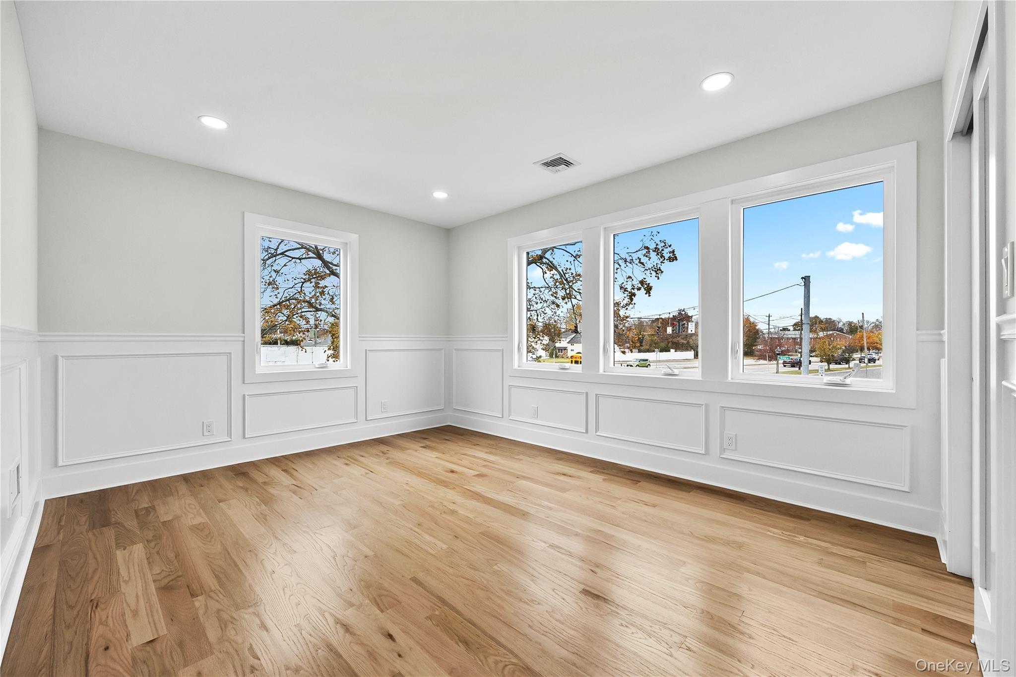 2 Orchid Road Levittown, NY 11756 - Photo 31 of 46 a view of a livingroom with wooden floor and window