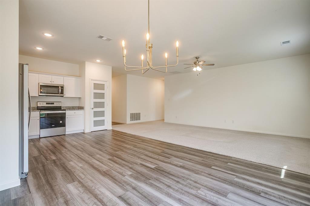 1405 Gentle Crk Lane Fort Worth, TX 76052 - Photo 17 of 40 a view of a kitchen with a stove top oven