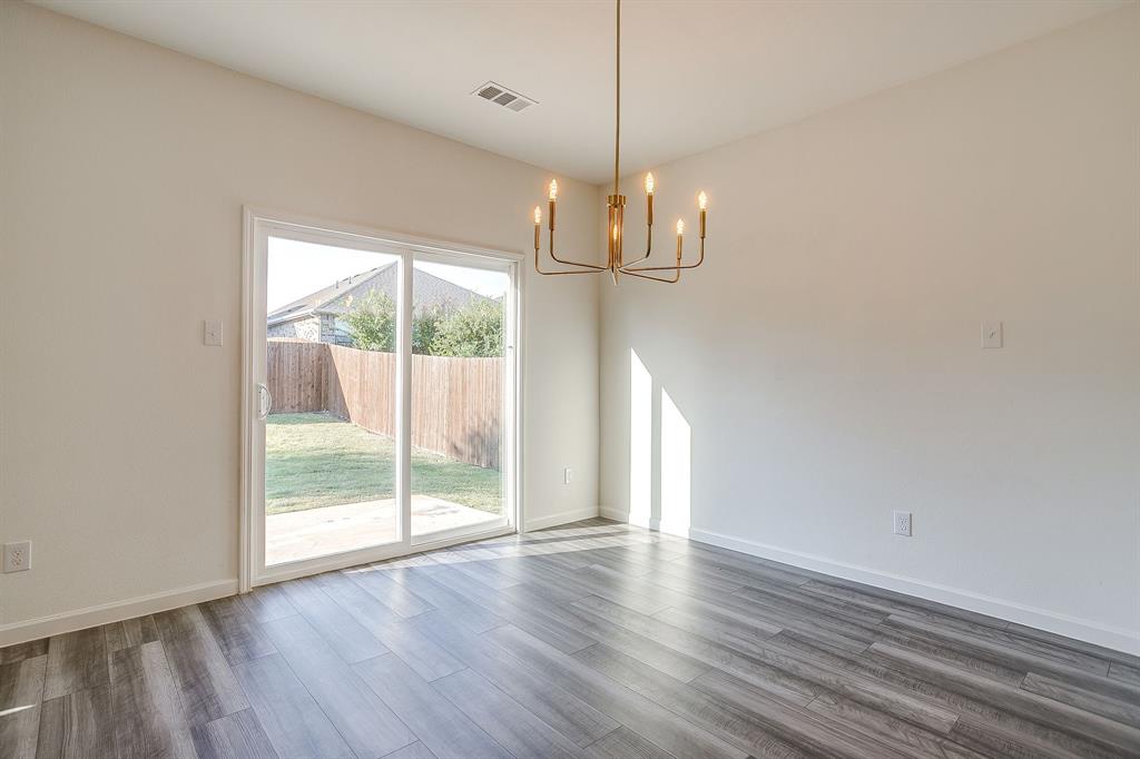 1405 Gentle Crk Lane Fort Worth, TX 76052 - Photo 20 of 40 a view of empty room with wooden floor and fan