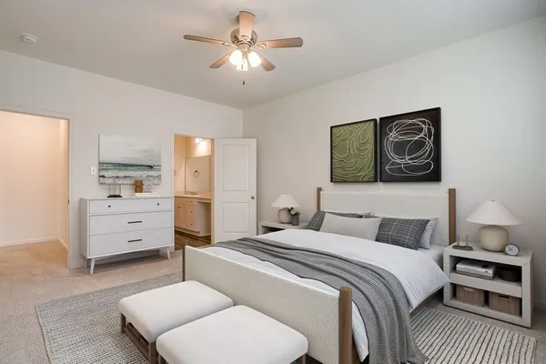 a bedroom with a bed and furniture