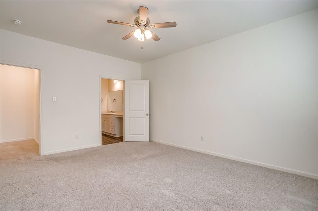 1405 Gentle Crk Lane Fort Worth, TX 76052 - Photo 27 of 40 a view of an empty room with a chandelier fan