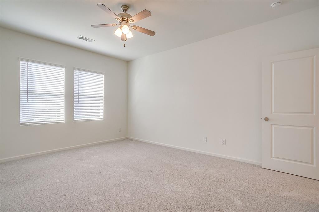 1405 Gentle Crk Lane Fort Worth, TX 76052 - Photo 29 of 40 a view of room with a ceiling fan and window