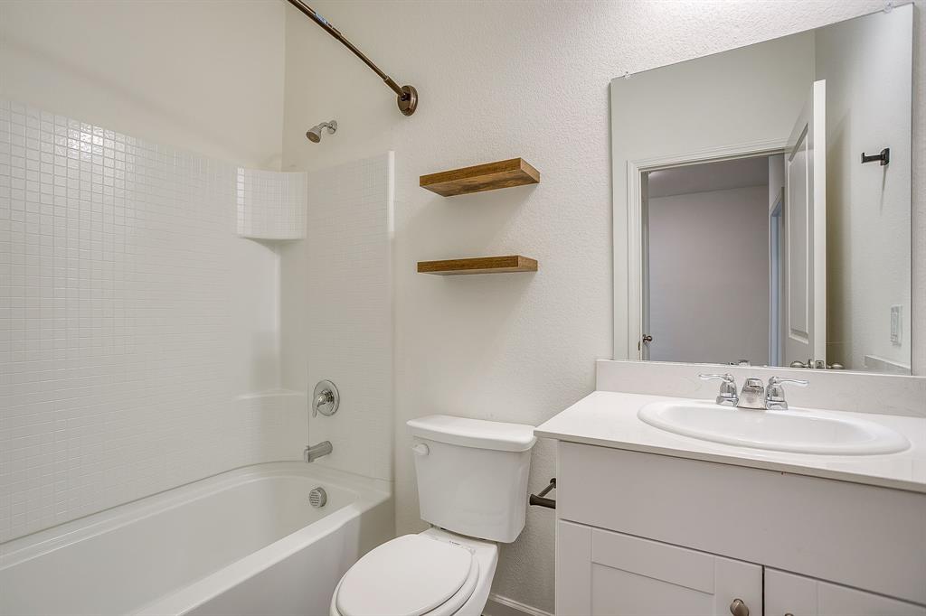 1405 Gentle Crk Lane Fort Worth, TX 76052 - Photo 34 of 40 a bathroom with a sink a toilet and shower