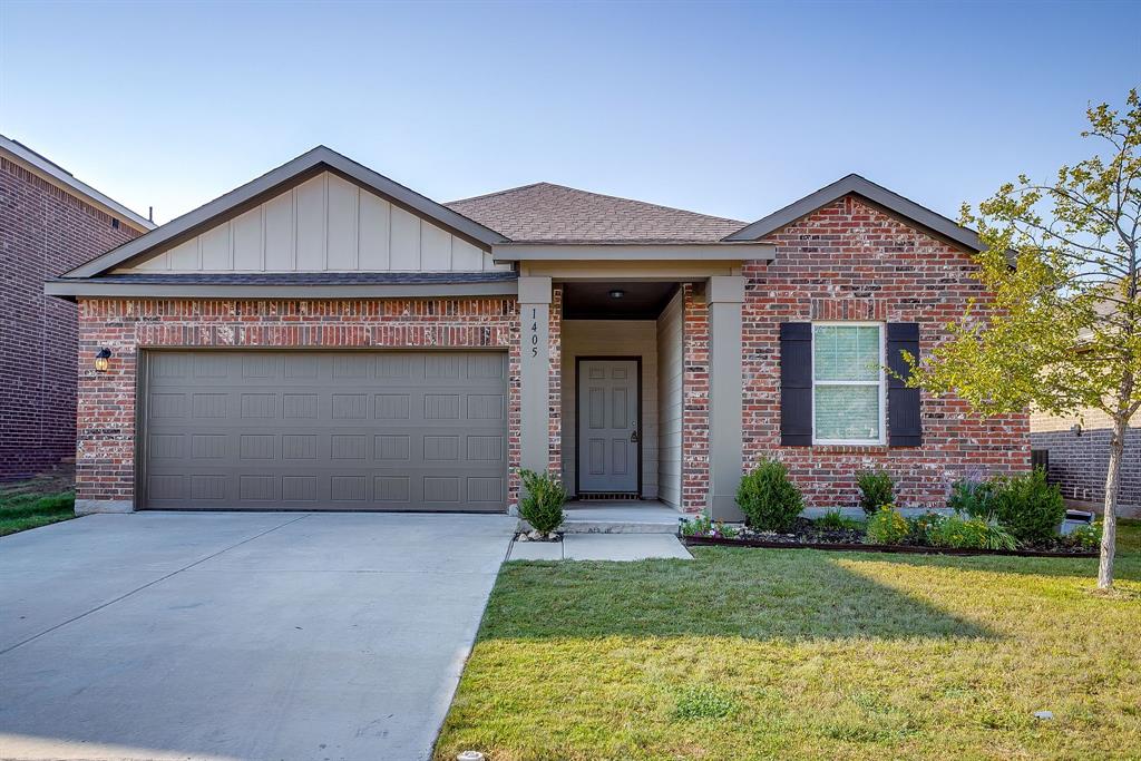 1405 Gentle Crk Lane Fort Worth, TX 76052 - Photo 4 of 40 a front view of a house with garden