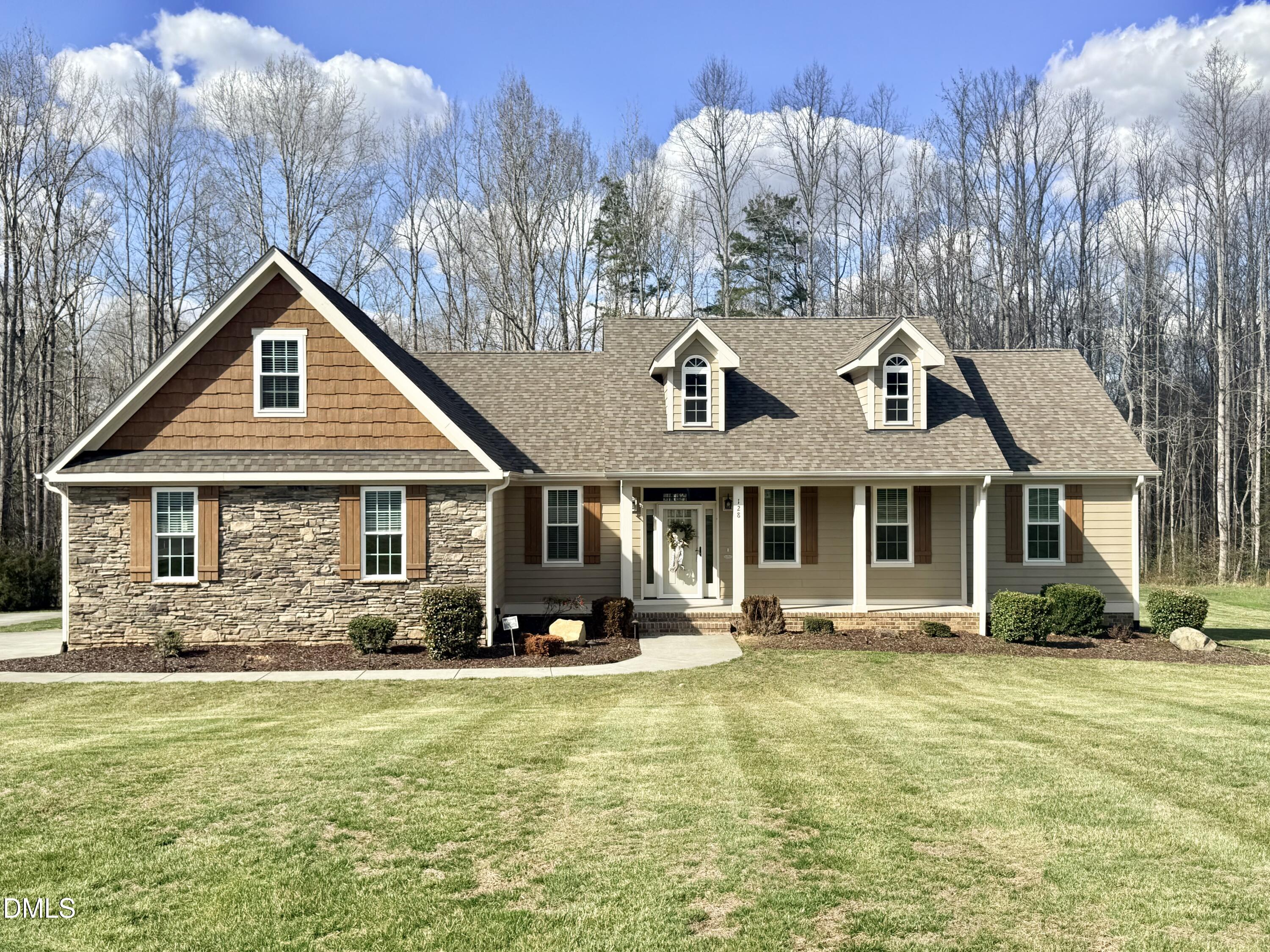 128 Bessie Lane Roxboro, NC 27574 - Photo 1 of 55 a front view of a house with garden