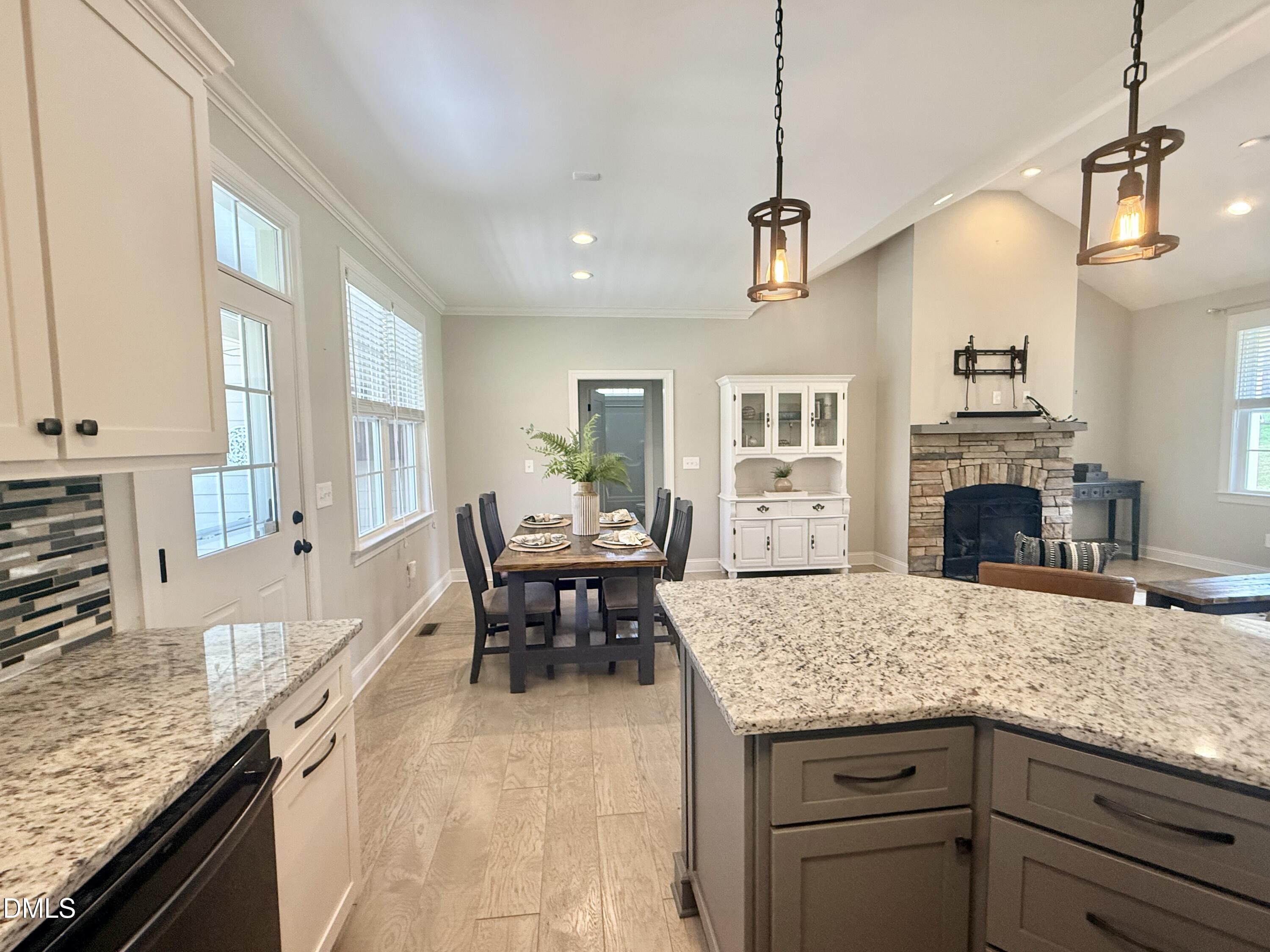 128 Bessie Lane Roxboro, NC 27574 - Photo 17 of 55 a kitchen with granite countertop living room and furniture