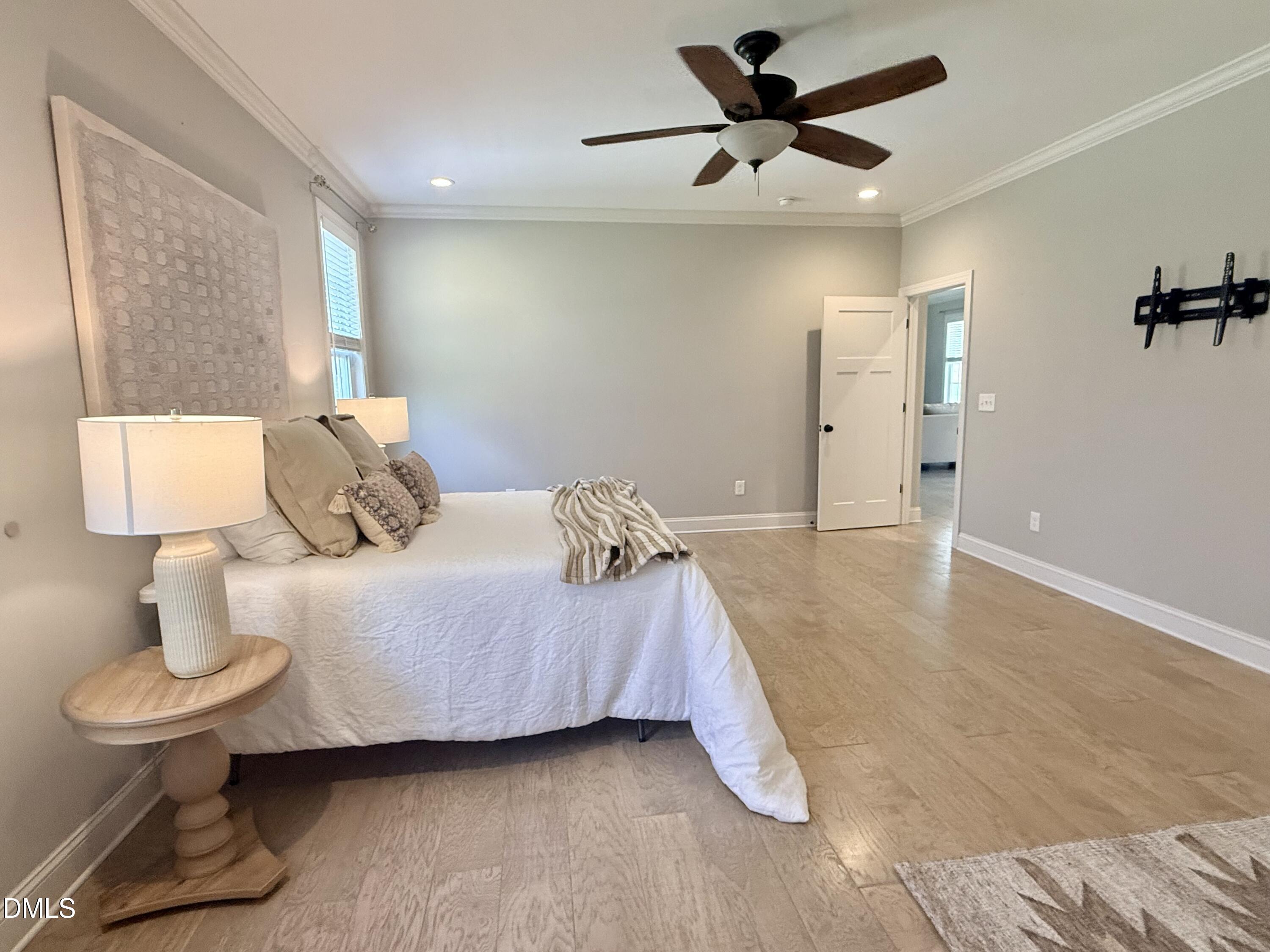128 Bessie Lane Roxboro, NC 27574 - Photo 20 of 55 a bedroom with a bed and a lamp on table