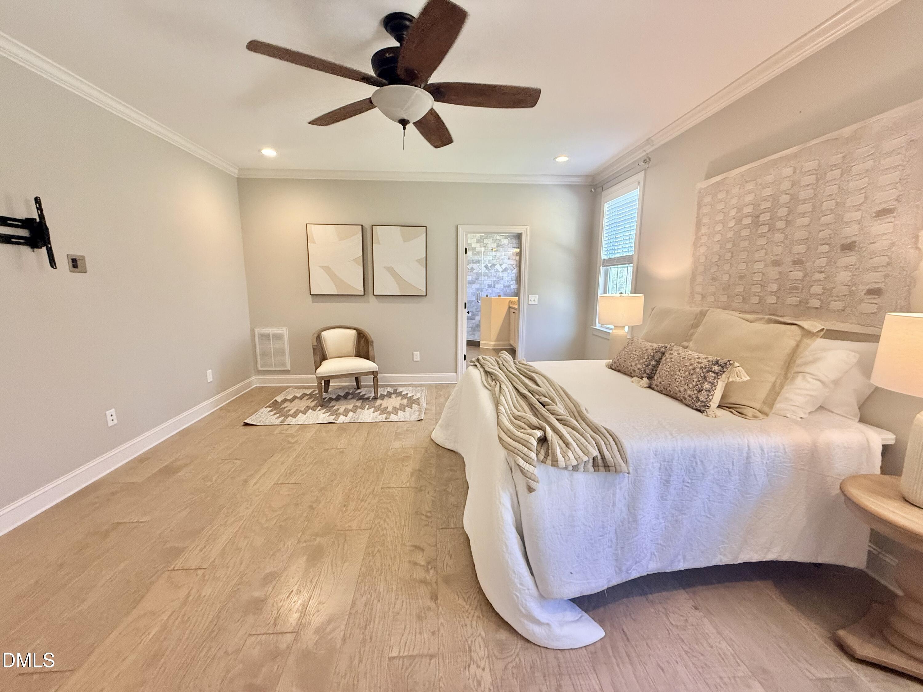 128 Bessie Lane Roxboro, NC 27574 - Photo 22 of 55 a bedroom with a bed and wooden floor