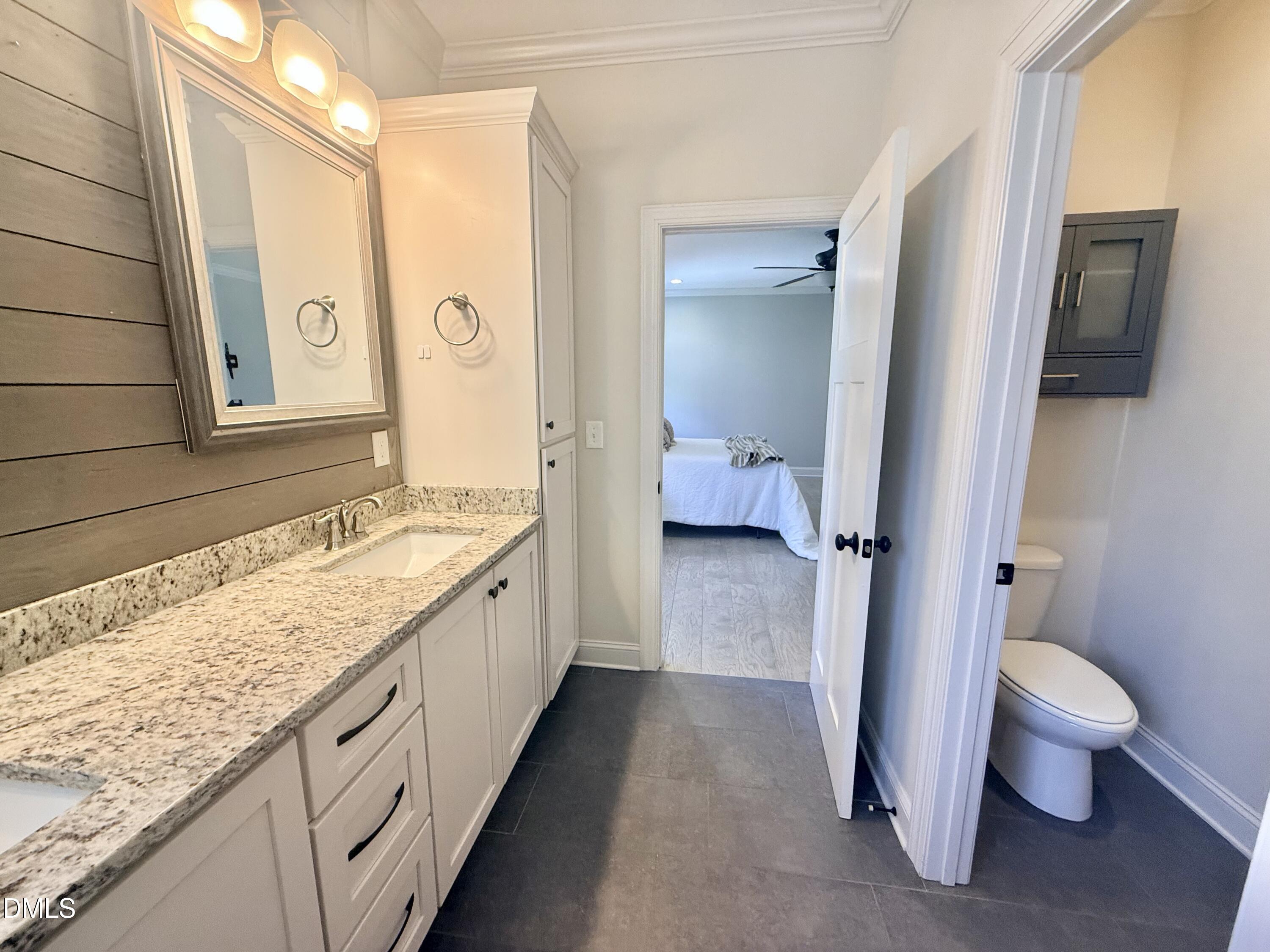 128 Bessie Lane Roxboro, NC 27574 - Photo 27 of 55 a spacious bathroom with a granite countertop sink and a mirror