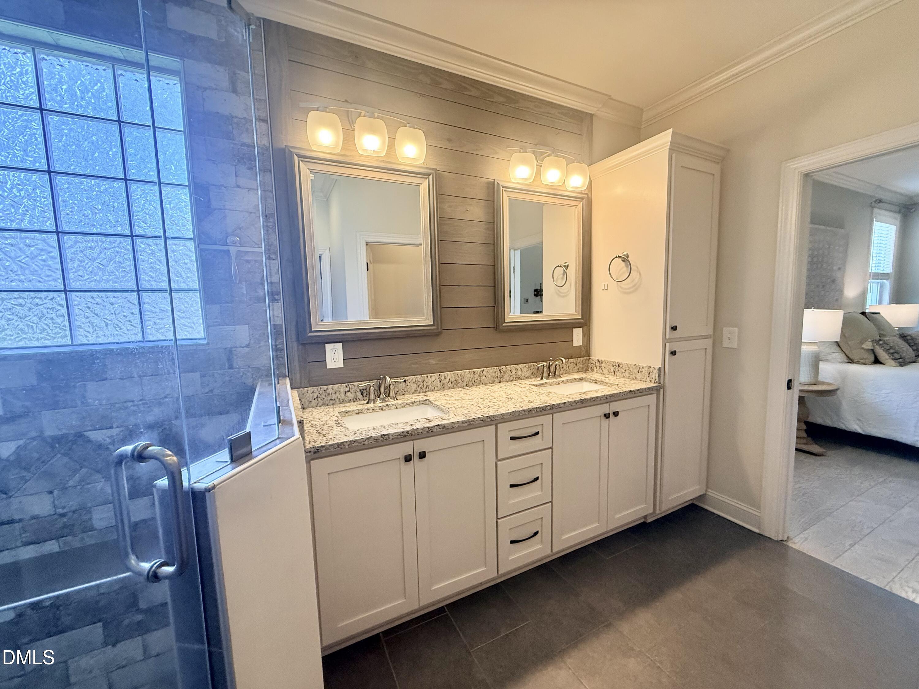 128 Bessie Lane Roxboro, NC 27574 - Photo 28 of 55 a bathroom with a double vanity sink and mirror
